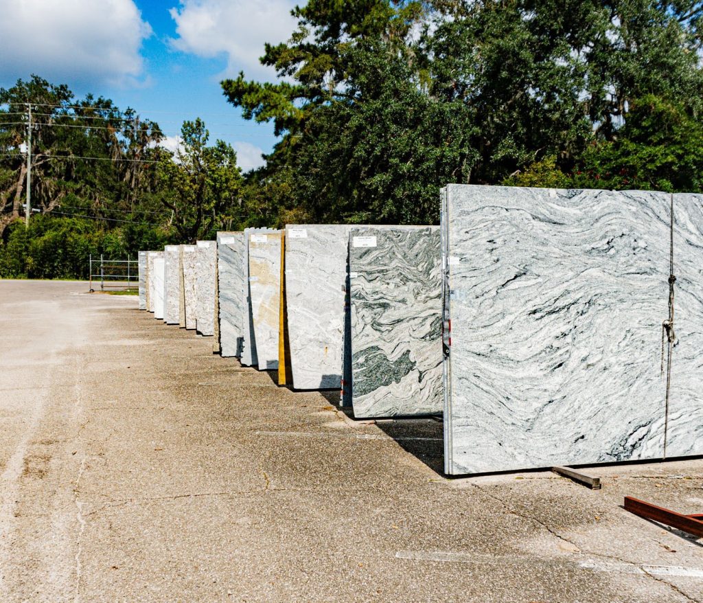 quartz countertop colors 2026 Jackson Stoneworks showroom display warm white greige sage green